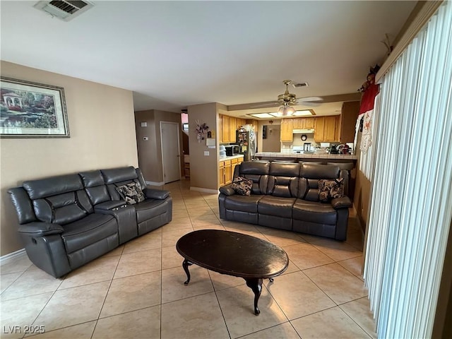 5517 Rock Creek Ln, Las Vegas, NV 89130 - living area with light tile patterned floors, baseboards, and a ceiling fan
