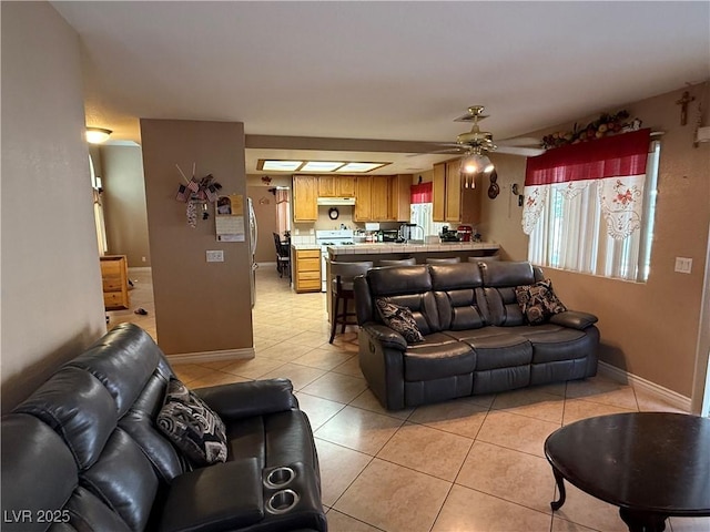 5517 Rock Creek Ln, Las Vegas, NV 89130 - living area featuring ceiling fan, light tile patterned floors, and baseboards