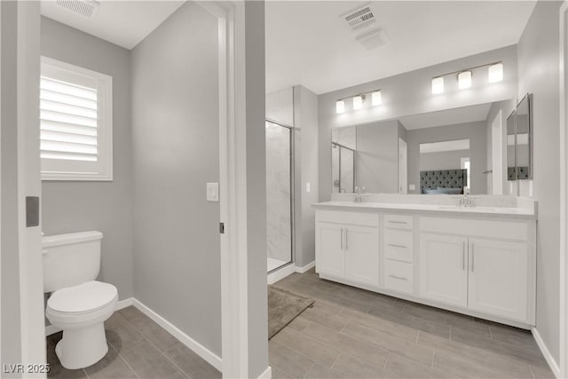 872 Pointe Arbor St, Henderson, NV 89011 - bathroom with toilet, double vanity, a shower stall, and baseboards