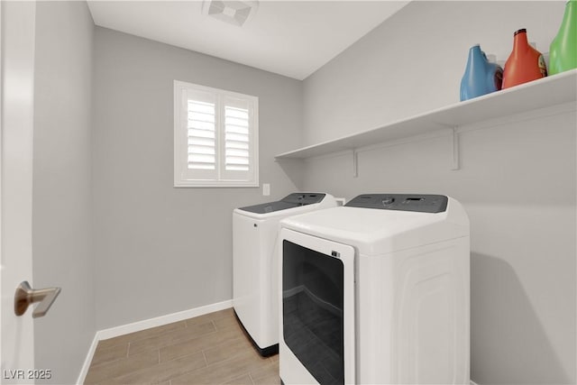 872 Pointe Arbor St, Henderson, NV 89011 - laundry area featuring washer and clothes dryer, wood finish floors, and baseboards