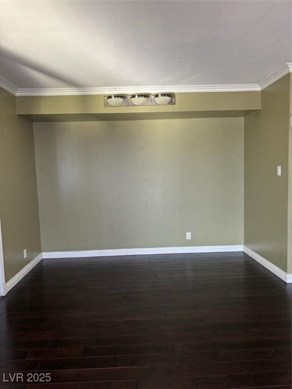 3930 University Center Dr Unit 702, Las Vegas, NV 89119 - empty room featuring dark wood-type flooring, baseboards, and crown molding