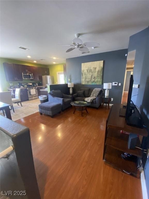 1511 Cardinal Peak Ln Unit 201, Las Vegas, NV 89144 - living room featuring ceiling fan and light wood-style floors