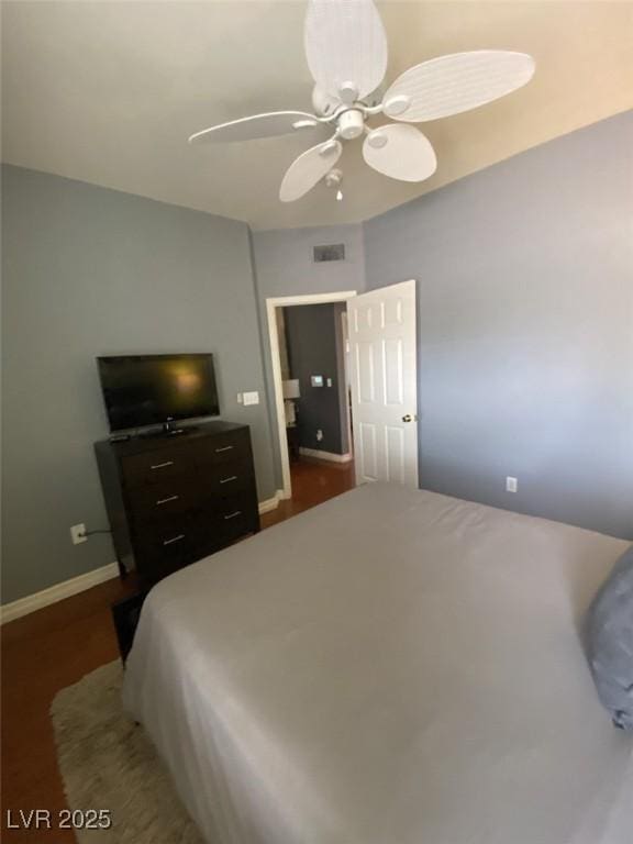 1511 Cardinal Peak Ln Unit 201, Las Vegas, NV 89144 - bedroom featuring baseboards, dark wood-style floors, and ceiling fan
