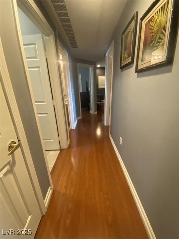 1511 Cardinal Peak Ln Unit 201, Las Vegas, NV 89144 - hallway with wood finished floors and baseboards