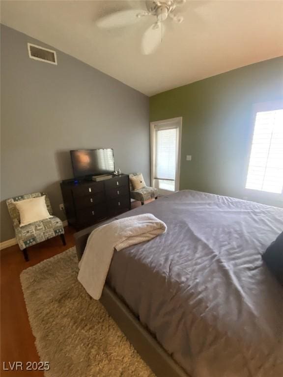 1511 Cardinal Peak Ln Unit 201, Las Vegas, NV 89144 - bedroom featuring vaulted ceiling, wood finished floors, and ceiling fan