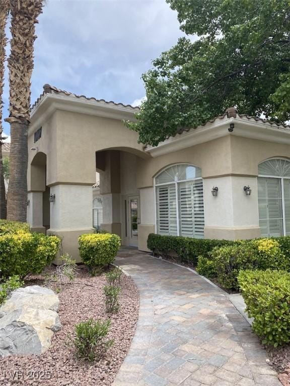 1511 Cardinal Peak Ln Unit 201, Las Vegas, NV 89144 - view of front of house with stucco siding and a tiled roof