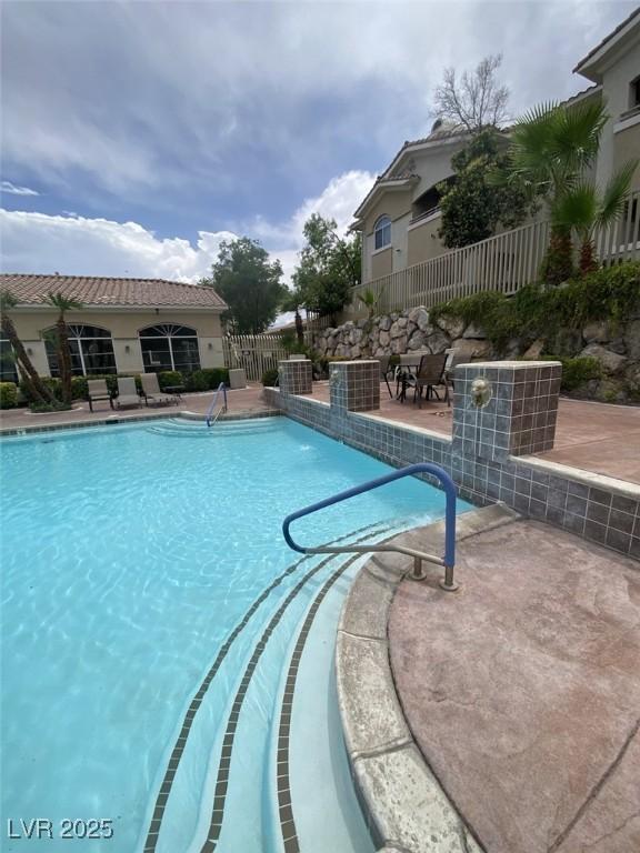 1511 Cardinal Peak Ln Unit 201, Las Vegas, NV 89144 - view of swimming pool featuring a patio area and central AC unit