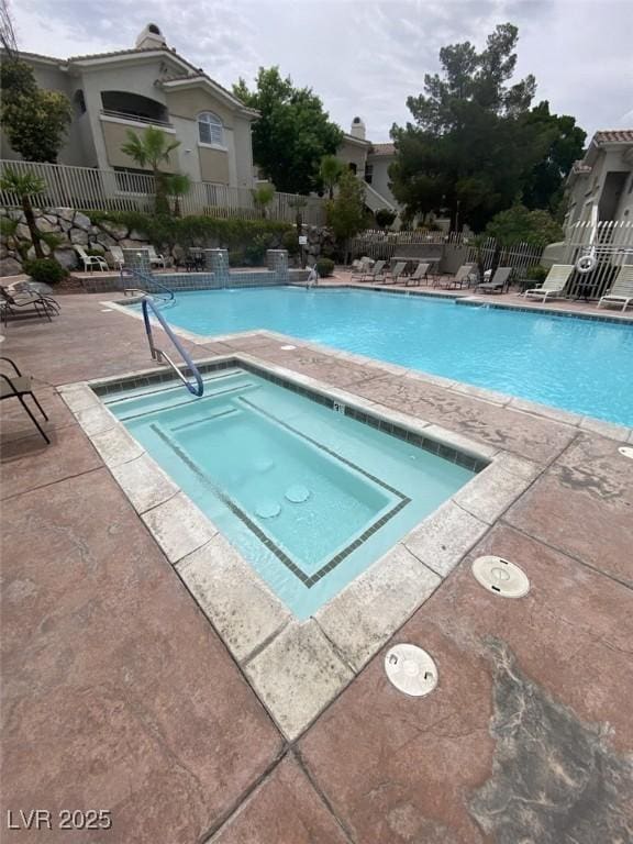 1511 Cardinal Peak Ln Unit 201, Las Vegas, NV 89144 - community pool with a patio area and a hot tub