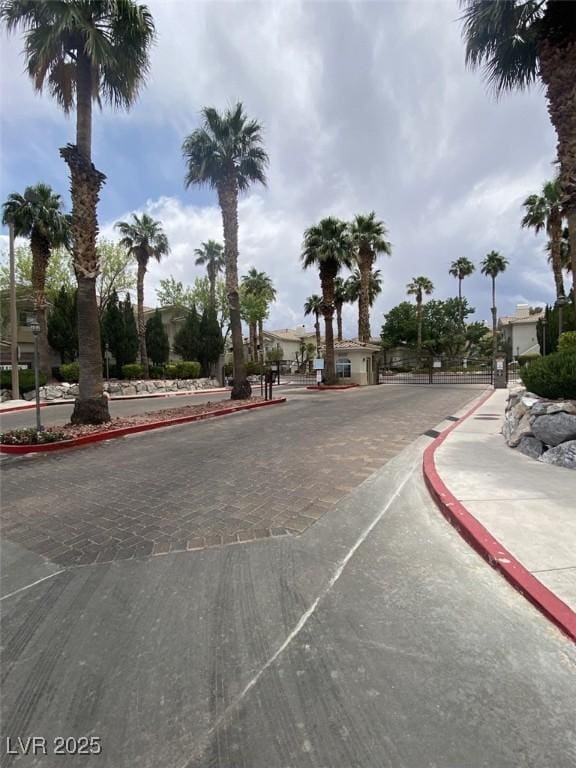 1511 Cardinal Peak Ln Unit 201, Las Vegas, NV 89144 - view of street with curbs, a gated entry, and sidewalks