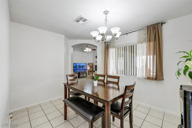341 Waterwheel Falls Dr, Henderson, NV 89015 - dining room featuring a chandelier, arched walkways, light tile patterned flooring, baseboards, and ceiling fan