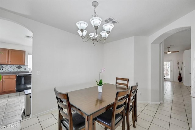 341 Waterwheel Falls Dr, Henderson, NV 89015 - dining room featuring arched walkways, light tile patterned flooring, a chandelier, a ceiling fan, and baseboards