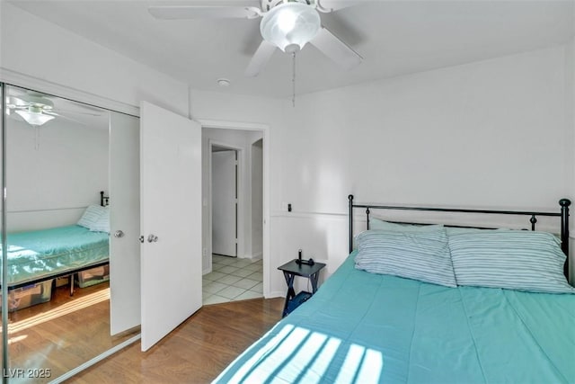 341 Waterwheel Falls Dr, Henderson, NV 89015 - bedroom with wood finished floors, a ceiling fan, and a closet