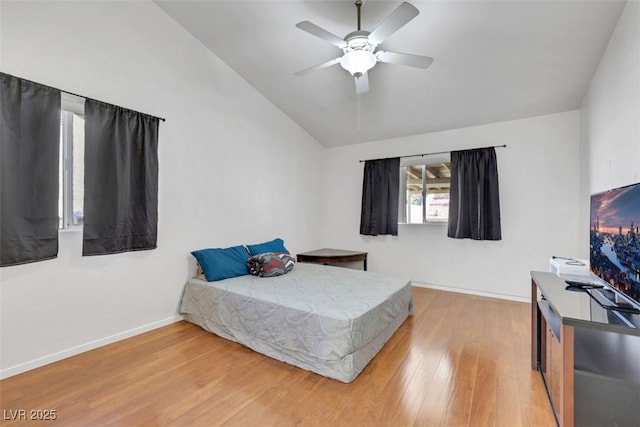 341 Waterwheel Falls Dr, Henderson, NV 89015 - bedroom with vaulted ceiling, light wood-type flooring, baseboards, and a ceiling fan
