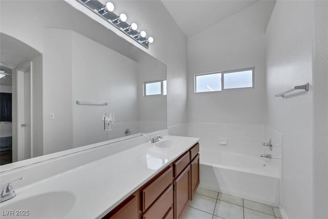 341 Waterwheel Falls Dr, Henderson, NV 89015 - bathroom with double vanity, a bath, tile patterned flooring, and lofted ceiling