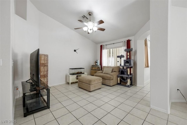 341 Waterwheel Falls Dr, Henderson, NV 89015 - living room featuring arched walkways, lofted ceiling, a ceiling fan, light tile patterned floors, and baseboards