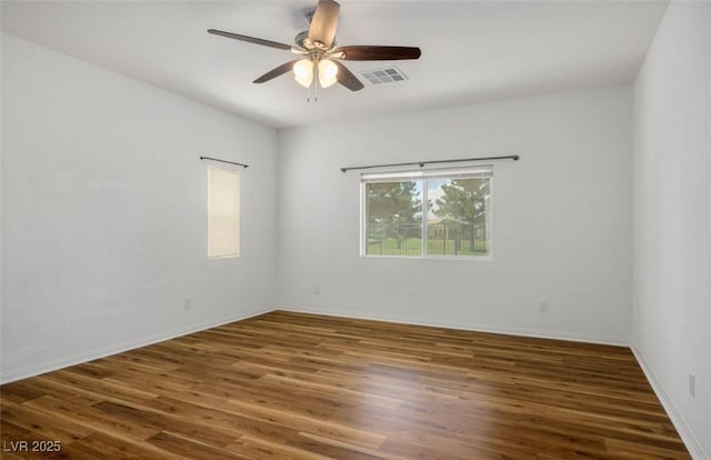5235 E Ln Campana Dr, Pahrump, NV 89061 - spare room featuring a ceiling fan, wood finished floors, and baseboards