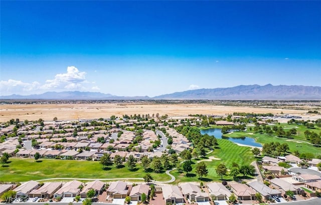 5235 E Ln Campana Dr, Pahrump, NV 89061 - aerial overview of property's location featuring a water and mountain view, nearby suburban area, and a golf course