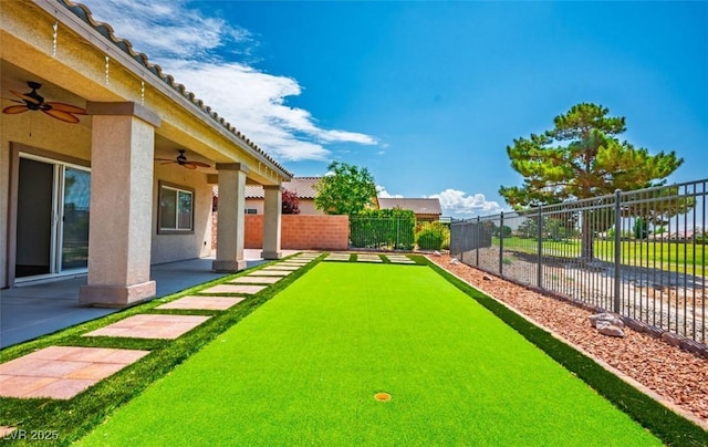 5235 E Ln Campana Dr, Pahrump, NV 89061 - view of yard featuring ceiling fan, a game area, and a patio area