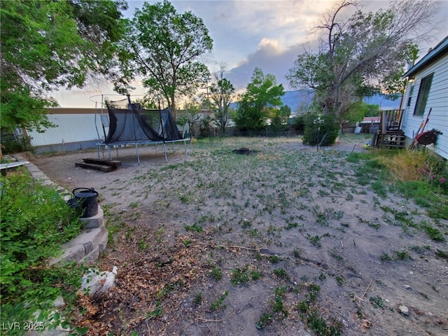 18 Third St, Mcgill, NV 89318 - yard at dusk featuring a trampoline