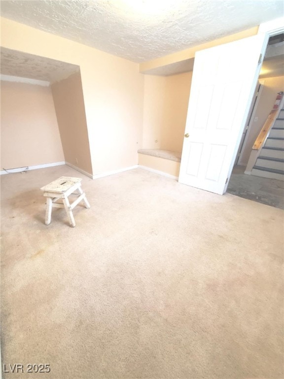 18 Third St, Mcgill, NV 89318 - finished below grade area with a textured ceiling, carpet floors, and stairway