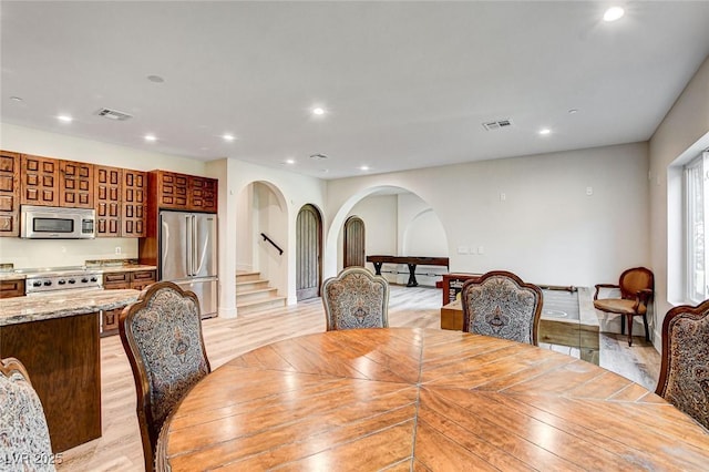 4162 Matterhorn Way, Las Vegas, NV 89124 - dining space with light wood-style floors, recessed lighting, and stairs