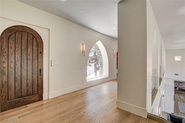 4162 Matterhorn Way, Las Vegas, NV 89124 - foyer entrance with hardwood / wood-style flooring, baseboards, and arched walkways