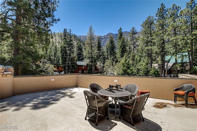 4162 Matterhorn Way, Las Vegas, NV 89124 - view of patio / terrace featuring a view of trees and a mountain view