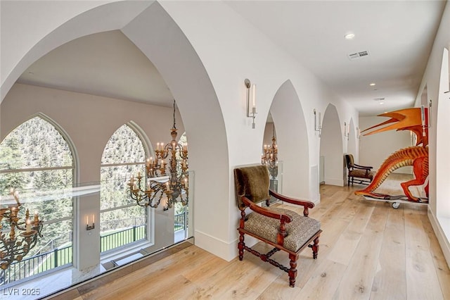 4162 Matterhorn Way, Las Vegas, NV 89124 - living area featuring arched walkways, hardwood / wood-style floors, recessed lighting, a chandelier, and baseboards