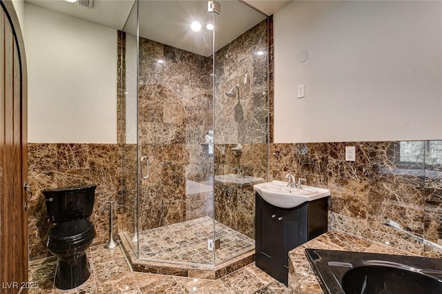 4162 Matterhorn Way, Las Vegas, NV 89124 - bathroom with vanity, tile walls, a shower stall, and toilet