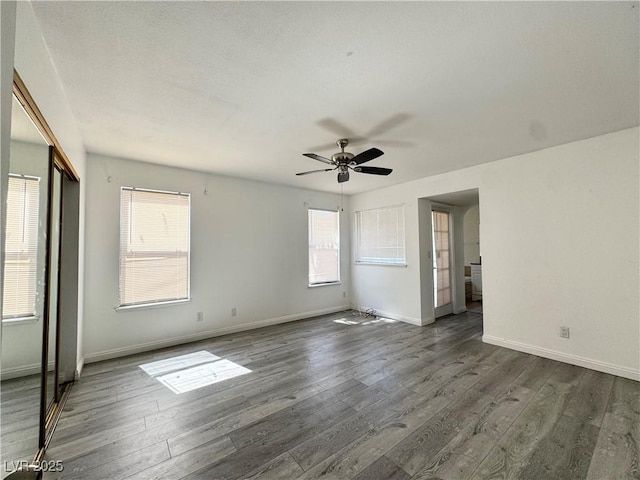 6137 W Oakey Blvd Unit A, Las Vegas, NV 89146 - unfurnished room with dark wood-style floors, plenty of natural light, and ceiling fan