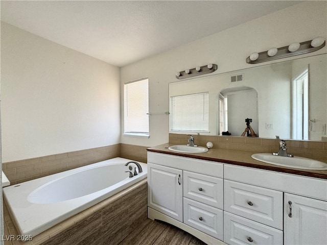 6137 W Oakey Blvd Unit A, Las Vegas, NV 89146 - bathroom with double vanity and a garden tub