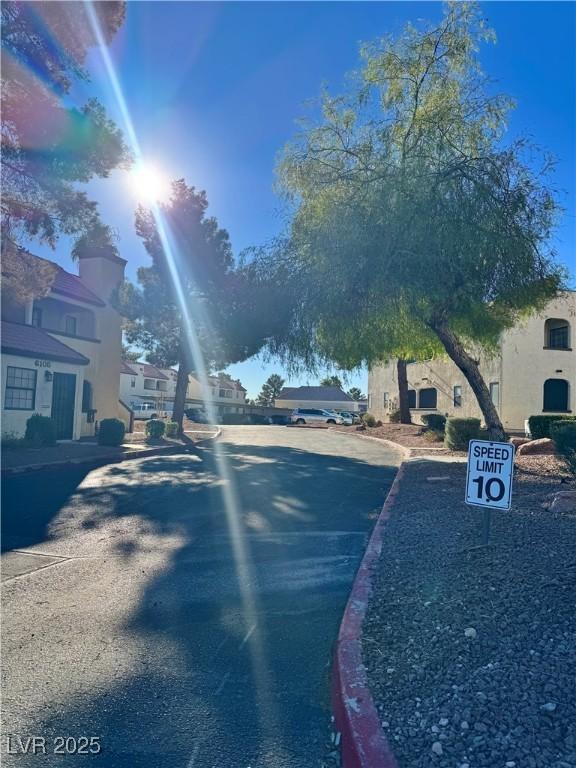6137 W Oakey Blvd Unit A, Las Vegas, NV 89146 - view of asphalt street featuring curbs and a residential view