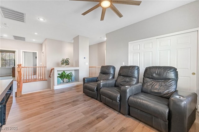 7821 Red Leaf Dr, Las Vegas, NV 89131 - home theater with a ceiling fan and light wood finished floors