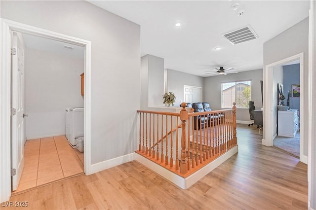 7821 Red Leaf Dr, Las Vegas, NV 89131 - hall featuring an upstairs landing, light wood finished floors, washer / clothes dryer, and recessed lighting