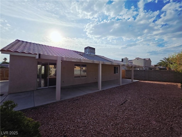4704 Wild Oak Way N, Las Vegas, NV 89031 - back of house featuring a tile roof, a patio, and stucco siding