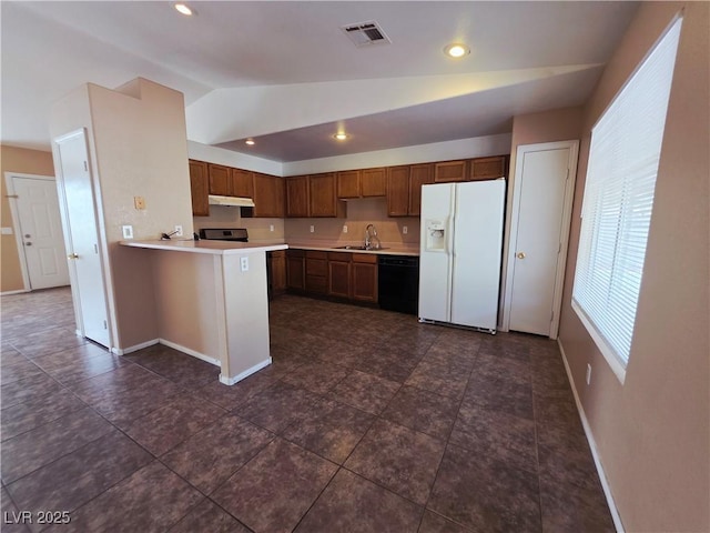 4704 Wild Oak Way N, Las Vegas, NV 89031 - kitchen with white fridge with ice dispenser, black dishwasher, under cabinet range hood, lofted ceiling, and light countertops