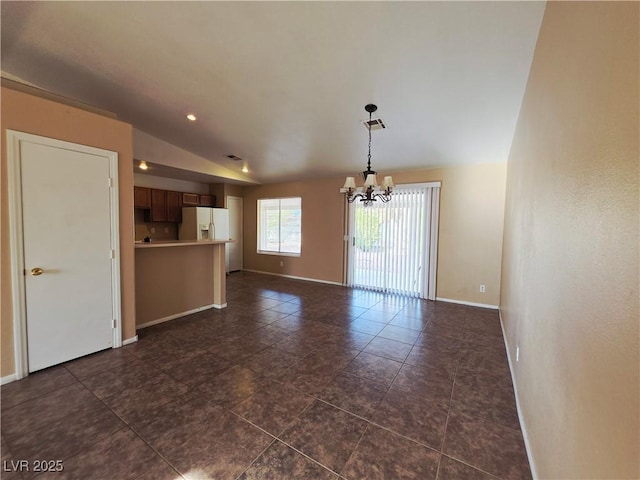 4704 Wild Oak Way N, Las Vegas, NV 89031 - unfurnished living room with a chandelier, lofted ceiling, dark tile patterned floors, and recessed lighting