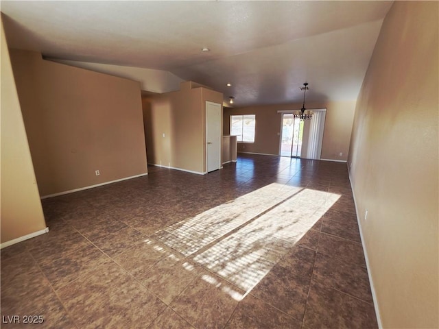 4704 Wild Oak Way N, Las Vegas, NV 89031 - unfurnished room featuring a chandelier, vaulted ceiling, and tile patterned floors