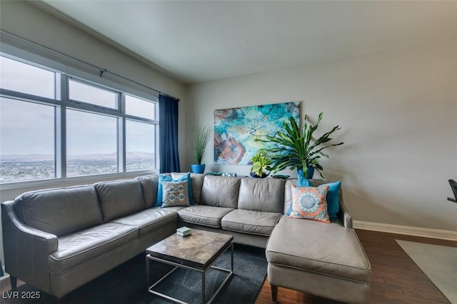 150 Las Vegas Blvd Unit 2115, Las Vegas, NV 89101 - living room featuring baseboards and wood finished floors