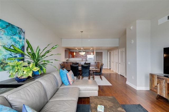 150 Las Vegas Blvd Unit 2115, Las Vegas, NV 89101 - living room featuring dark wood finished floors and baseboards