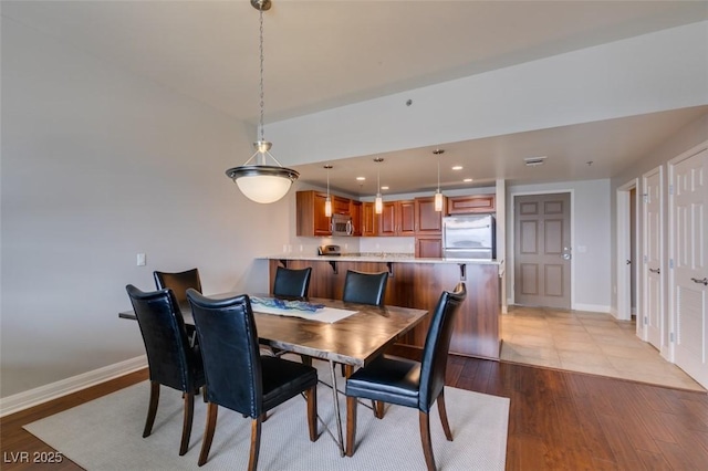 150 Las Vegas Blvd Unit 2115, Las Vegas, NV 89101 - dining area featuring light wood finished floors, recessed lighting, and baseboards