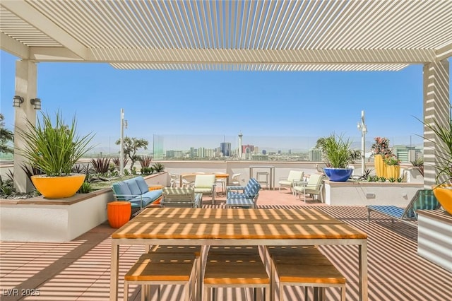 150 Las Vegas Blvd Unit 2115, Las Vegas, NV 89101 - view of patio featuring a pergola, a city view, an outdoor hangout area, and outdoor dining area