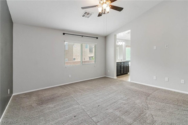 7345 Chesapeake Cove St, Las Vegas, NV 89166 - empty room with ceiling fan, light colored carpet, vaulted ceiling, and baseboards