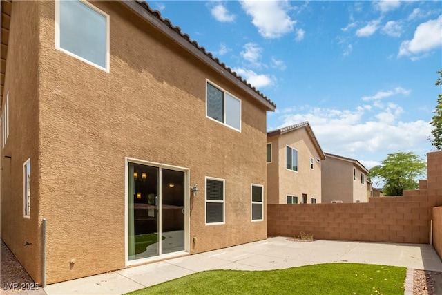 7345 Chesapeake Cove St, Las Vegas, NV 89166 - back of property featuring stucco siding and a patio