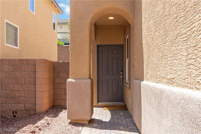 7345 Chesapeake Cove St, Las Vegas, NV 89166 - doorway to property featuring stucco siding
