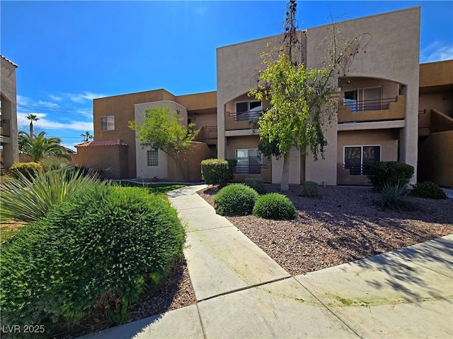 6853 Tamarus St Unit 202, Las Vegas, NV 89119 - view of front of home with stucco siding