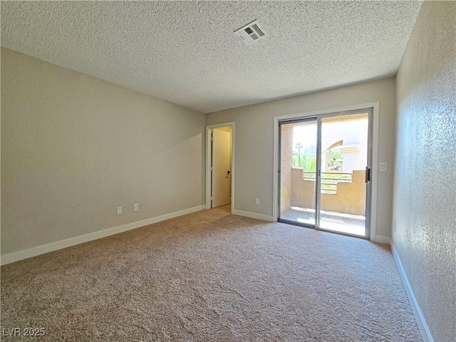 6853 Tamarus St Unit 202, Las Vegas, NV 89119 - spare room featuring carpet, a textured ceiling, and baseboards