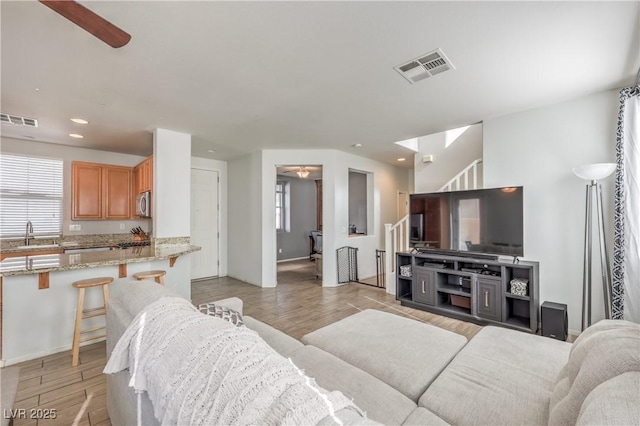 5232 Pendergrass St, North Las Vegas, NV 89081 - living room featuring a ceiling fan, recessed lighting, and light wood-style floors
