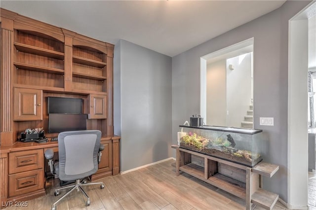 5232 Pendergrass St, North Las Vegas, NV 89081 - office space with light wood-style floors, baseboards, and built in study area
