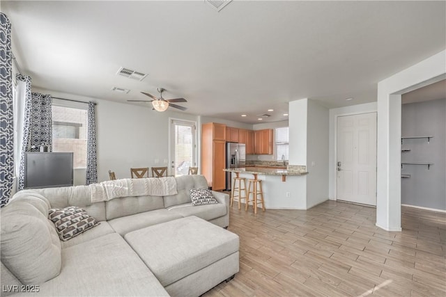 5232 Pendergrass St, North Las Vegas, NV 89081 - living area with recessed lighting, ceiling fan, light wood finished floors, and baseboards